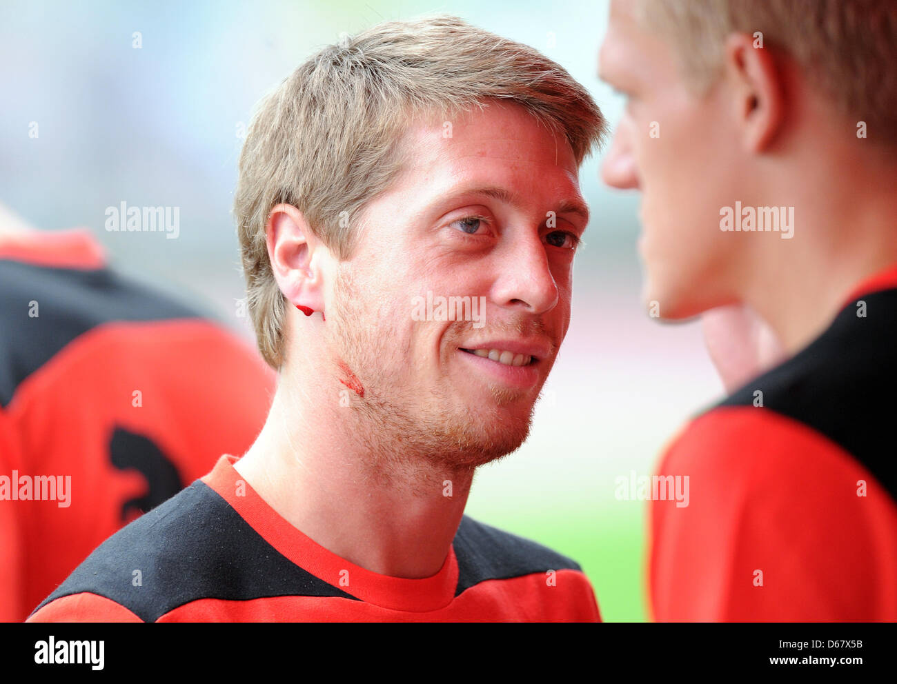 Duesseldorf's Andreas Lambertz bleeds after his lactate test during the start of training after the summer break on the practice field in Duesseldorf, Germany, 28 June 2012. Photo: CAROLINE SEIDEL Stock Photo
