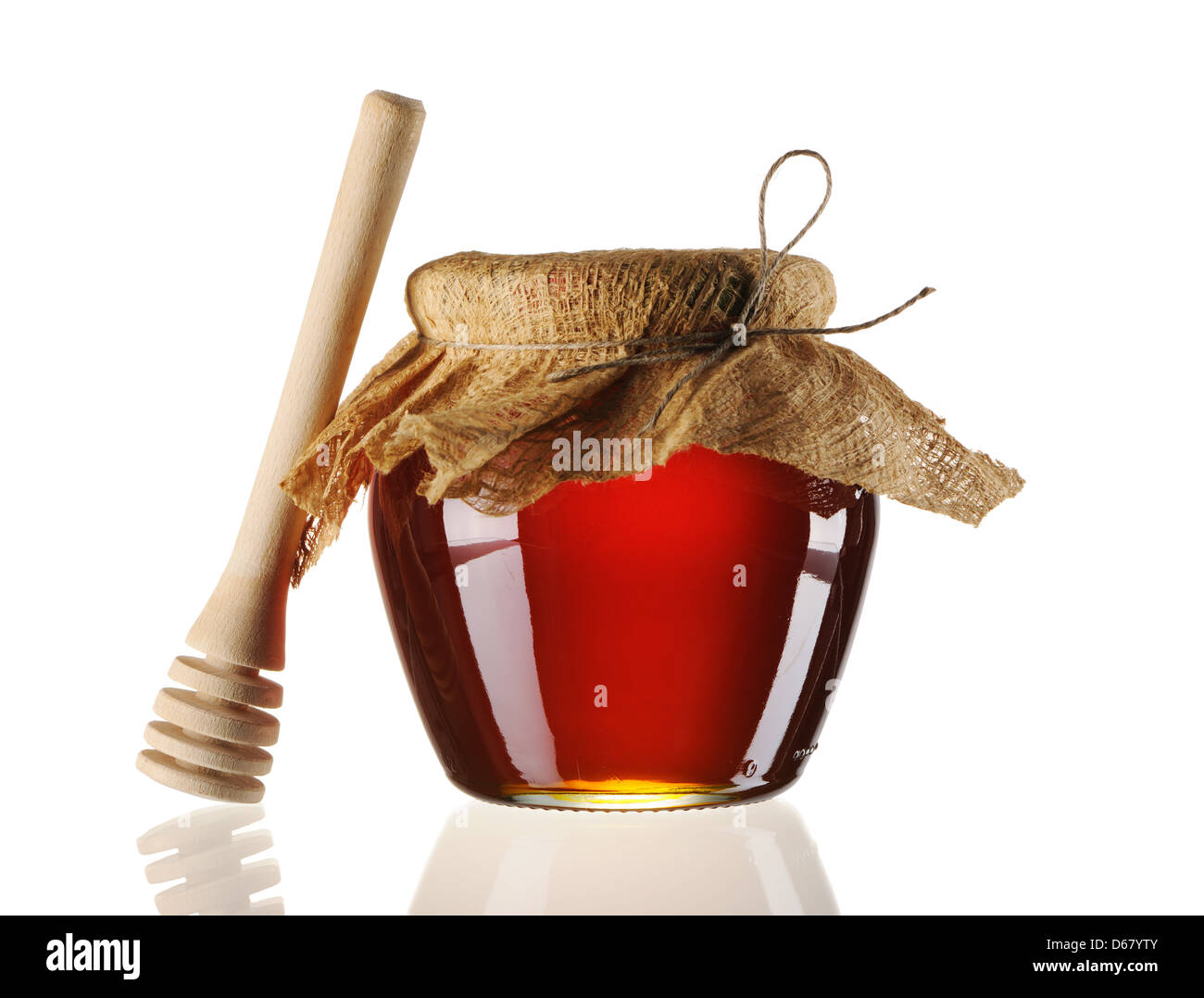 Jar of honey and dipper Stock Photo Alamy