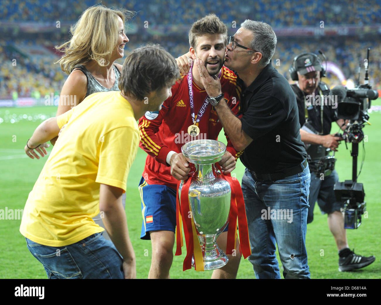 Spain's Gerard Piquet is congratulated by his father, mother and ...