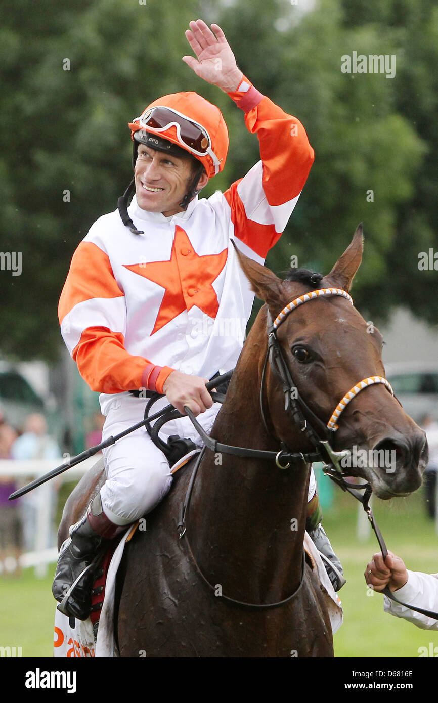 Jockey Terence Hellier sitting on his horse 'Pastorius' cheers after