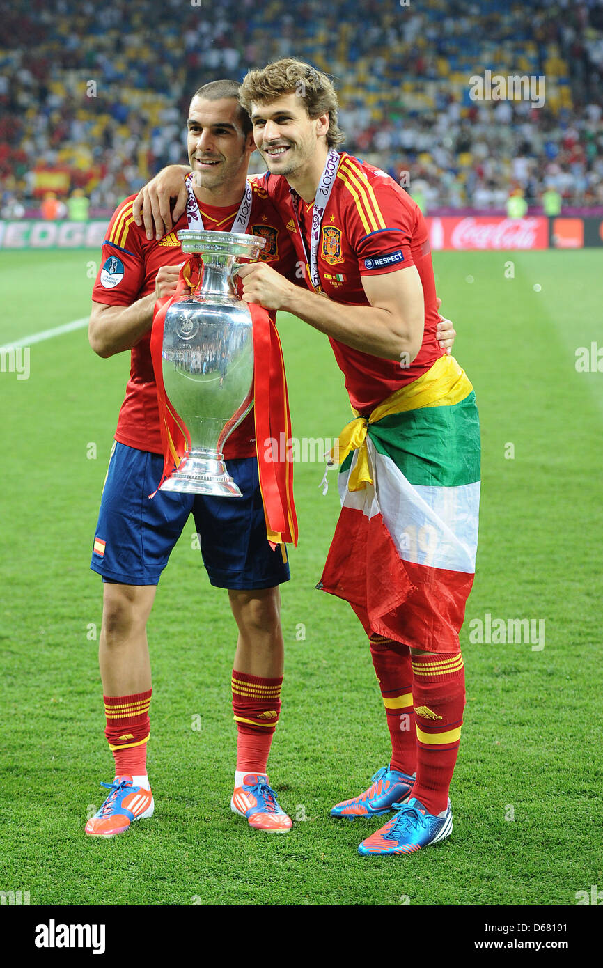 Spain's Alvaro Negredo (L) and Fernando Llorente hold the Uefa cup after the UEFA EURO 2012 final soccer match Spain vs. Italy at the Olympic Stadium in Kiev, Ukraine, 01 July 2012. Spain won 4-0. Photo: Revierfoto Stock Photo