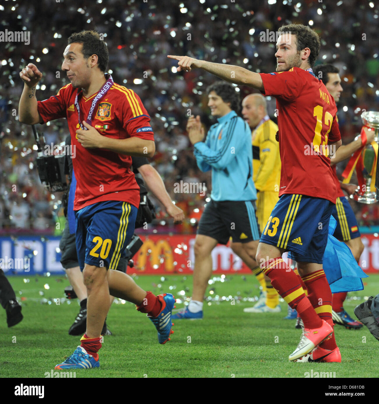 Spain's Santi Cazorla (L) and Juan Mata (R) celebrate after winning the UEFA EURO 2012 final soccer match Spain vs. Italy at the Olympic Stadium in Kiev, Ukraine, 01 July 2012. Photo: Andreas Gebert dpa (Please refer to chapters 7 and 8 of http://dpaq.de/Ziovh for UEFA Euro 2012 Terms & Conditions) Stock Photo