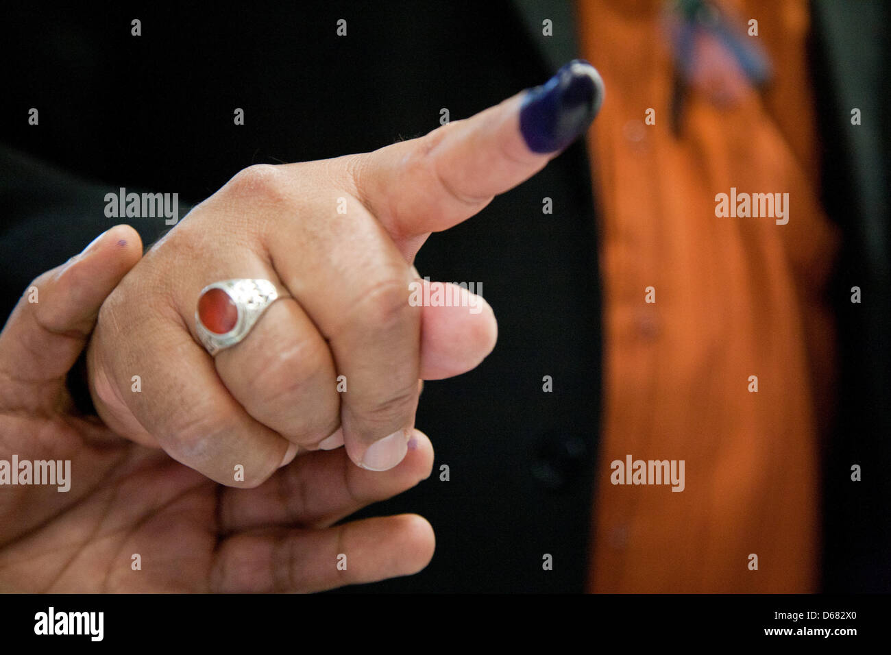 A Libyan man, with indelible ink on his finger as a sign that he has voted, shows his finger at a polling station in Berlin, Germany, 03 July 2012. The election of the Libyan national congress has started in Germany. On the first of five election days, there was a small turnout, according to advisor for the Libyan electoral commission in Germany, Graibei in Berlin on Tuesday. Photo Stock Photo