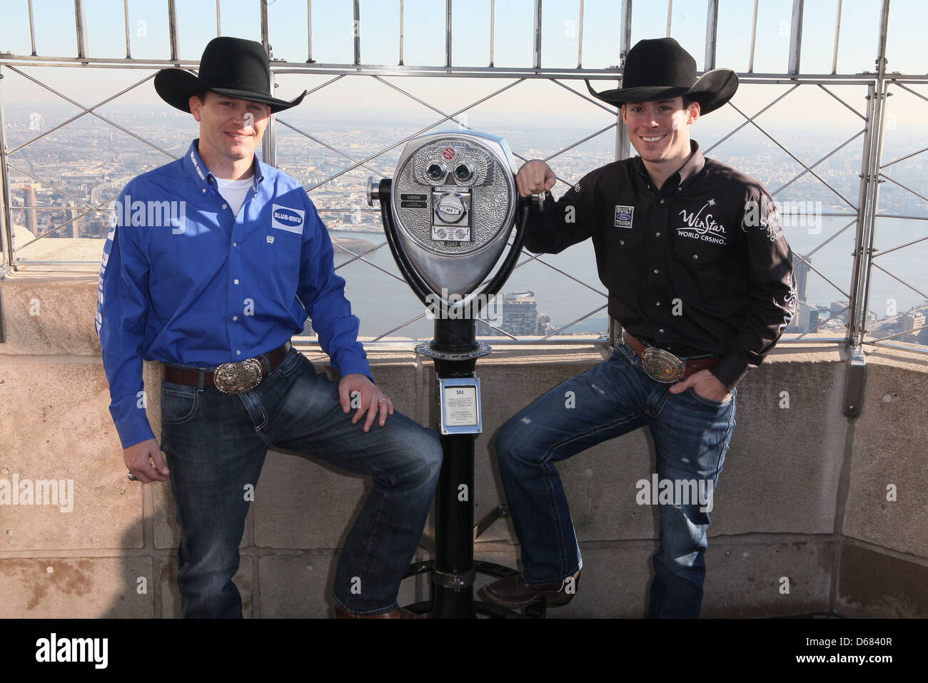 Professional Bull Riders (PBR) Colby Yates and Luke Snyder visit The Empire State Building New York City, USA - 13.12.11 Stock Photo