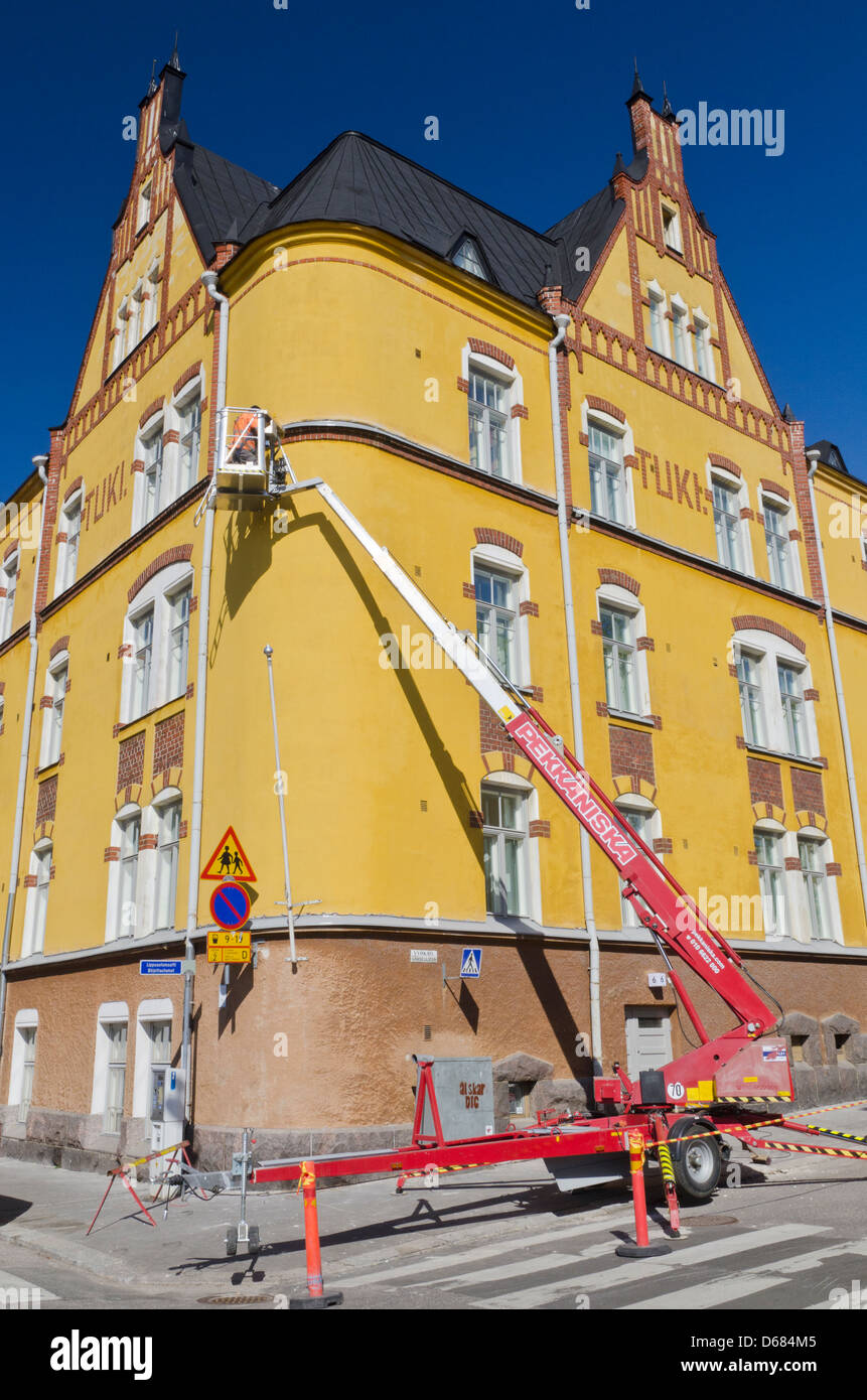 Restoring Art Nouveau style architecture via an Elevated Work Platform on the Katajanokka Peninsula, Helsinki, Finland Stock Photo