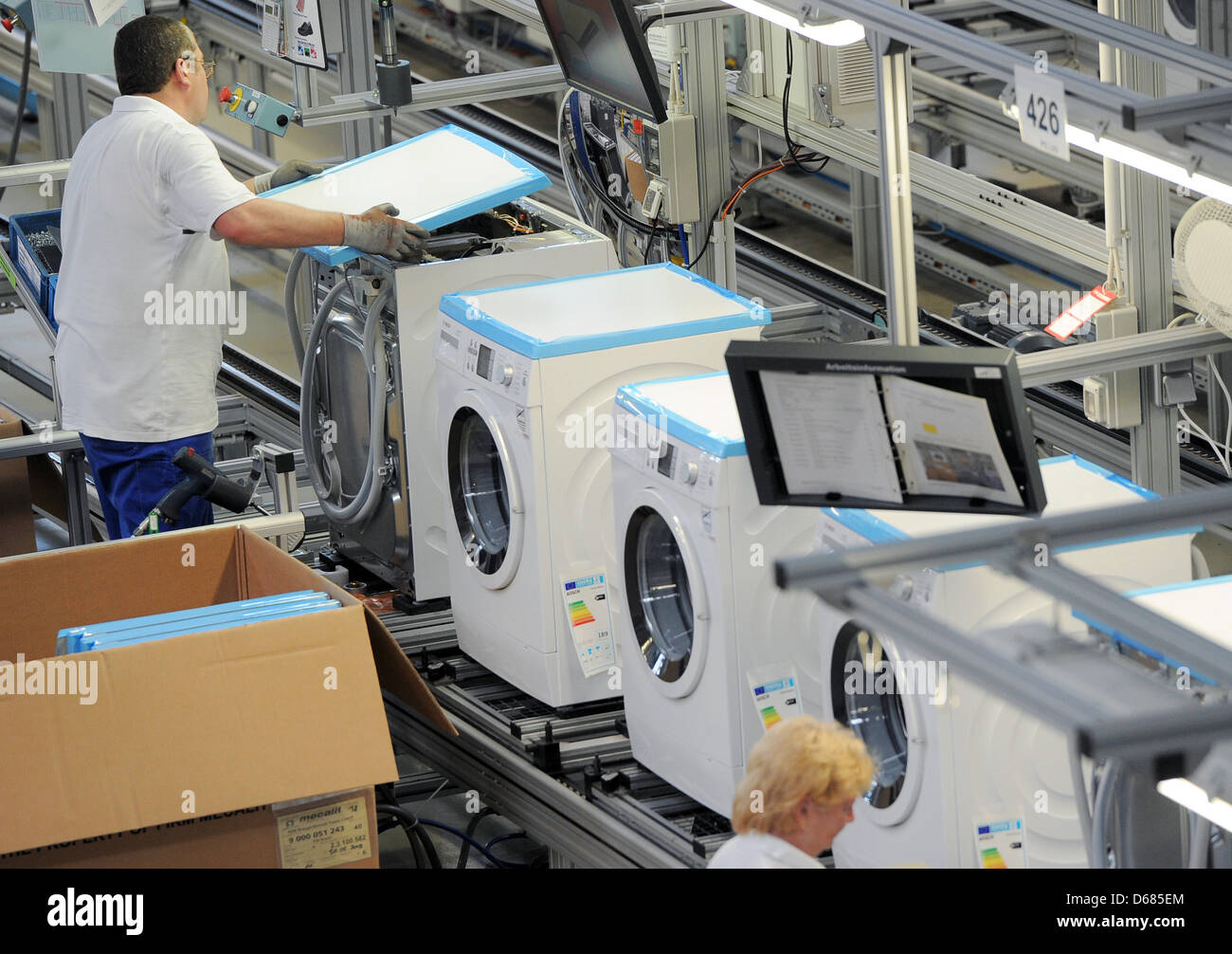 Workers of Bosch Siemens Hausgeraete GmbH assemble washing machines in  Nauen, Germany, 4 July 2012. About 600 employees produce approximately  800,000 premium-quality washing machines annually, of which two thirds are  exported. BSH