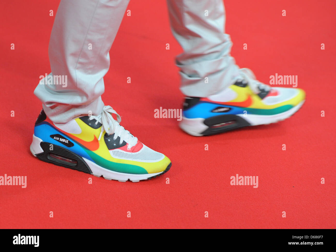 A guest wears coloured shoes as he arrives at the Camp David Show during  the Fashion Week in the Olympic Stadium in Berlin, Germany, 05 July 2012.  The presentation of the Spring/Summer