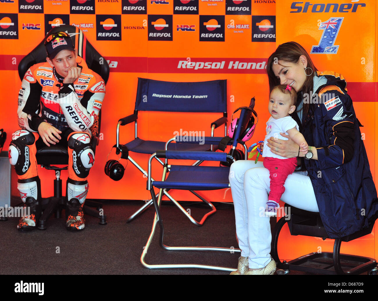 Australian MotoGP racer Casey Stoner from team Repsol Honda and his wife Adriana sit in the Honda box before training for the German Grand Prix on the Sachsenring in Hohenstein-Ernstthal, Germany, 06