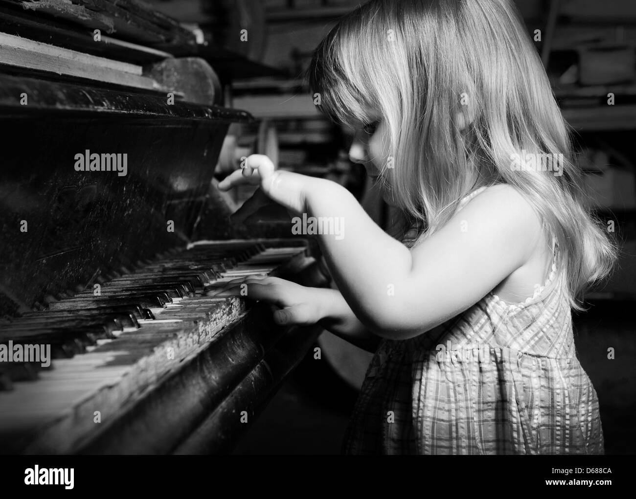 girl playing on an piano Stock Photo - Alamy