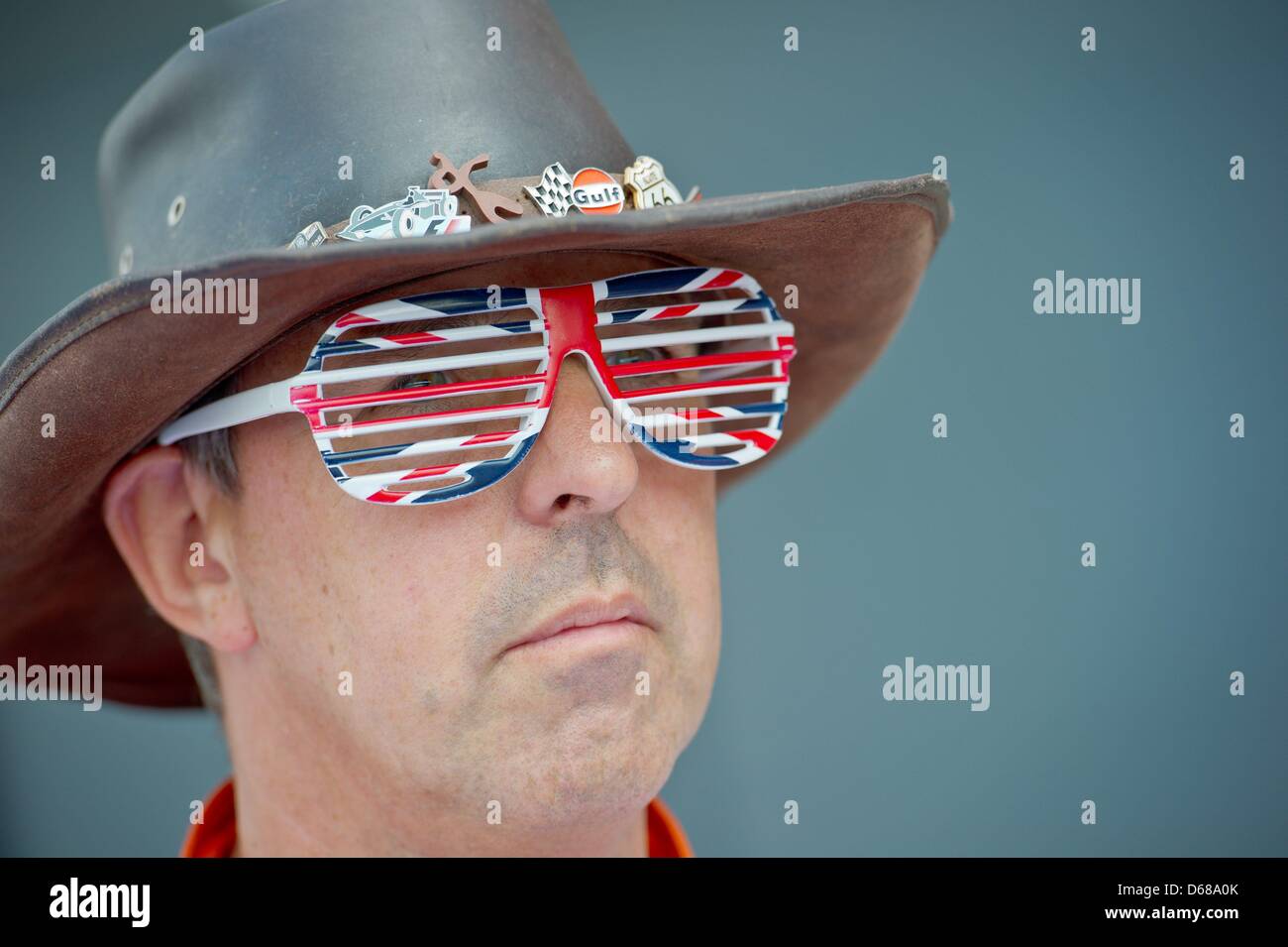 A Marshal wears glasses in a British design during the Grand Prix of Great Britain at the Silverstone race track in Northamptonshire, Great Britain, 08 July 2012. Photo: David Ebener dpa  +++(c) dpa - Bildfunk+++ Stock Photo