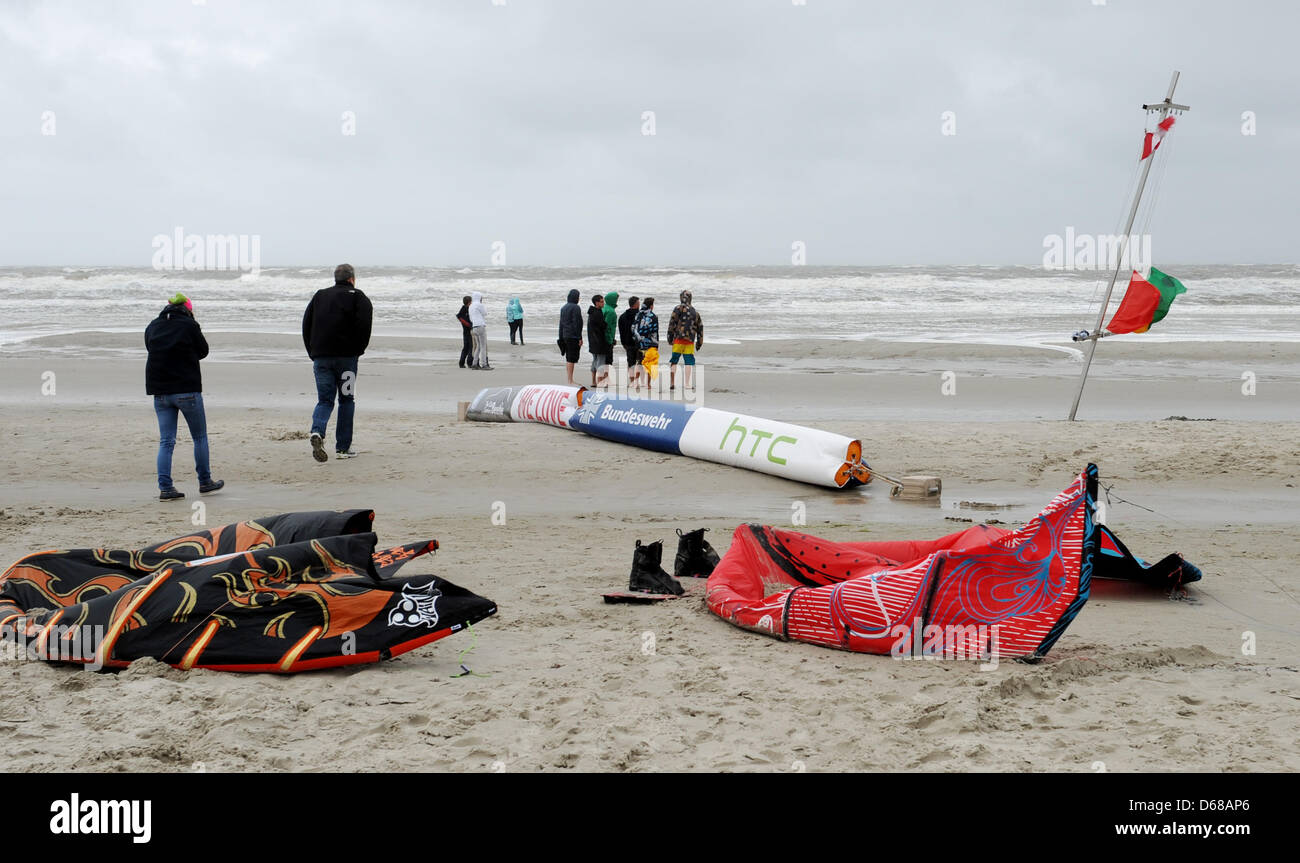 Kite sails lie on the beach, where the Kite Surfing World Cup was canceled due to bad weather in St.Peter-Ording, Germany, 09 July 2012. Photo: Angelika Warmuth Stock Photo