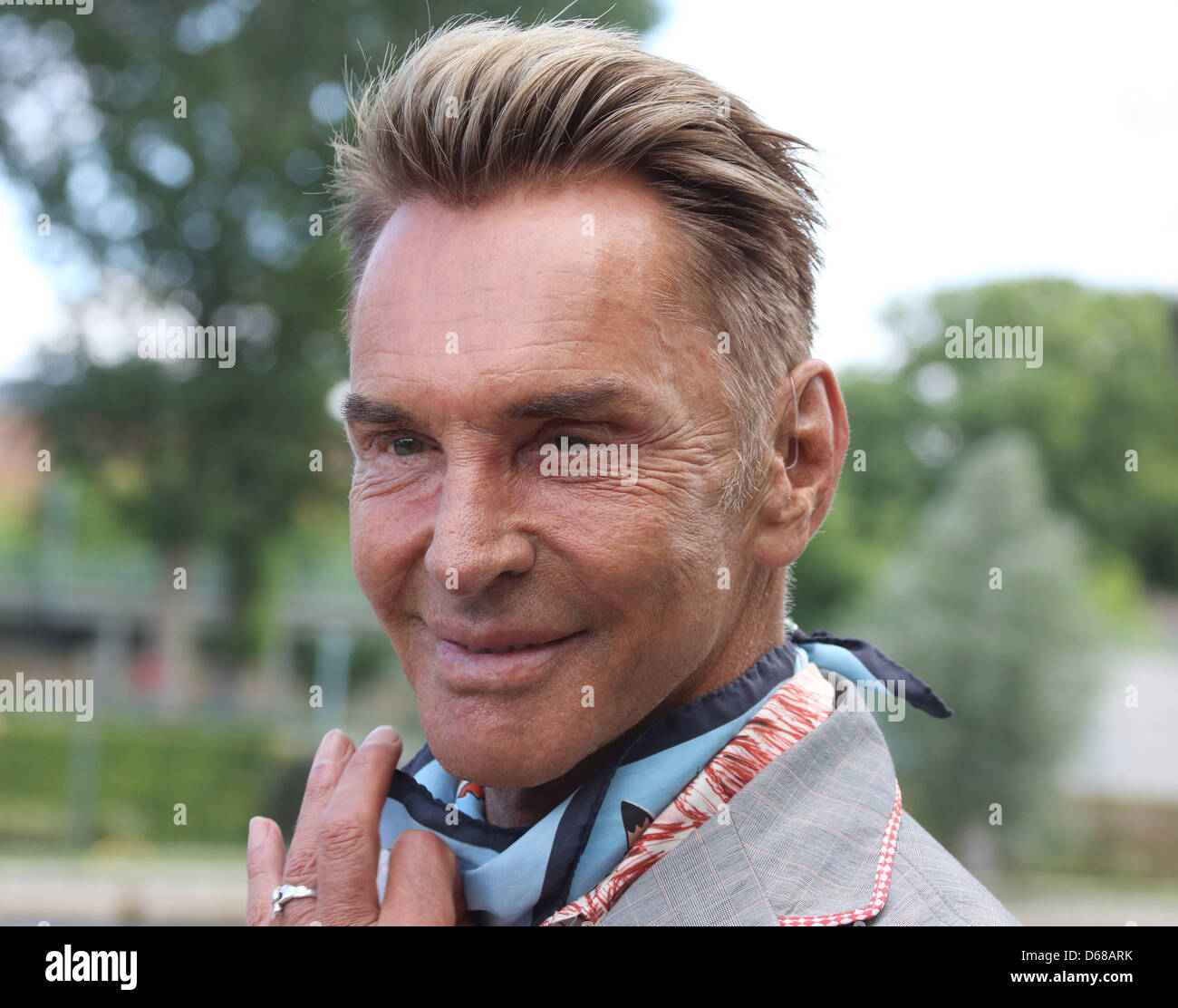 Fashion designer Wolfgang Joop waits to board the passenger ship