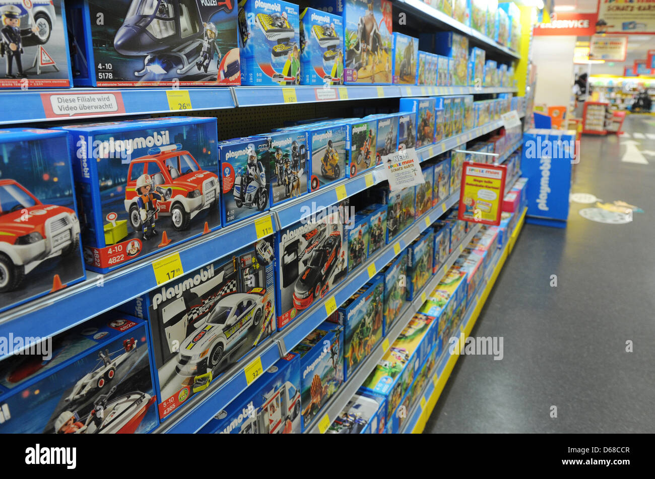 Playmobil toys sit on a shelf in a toy store in Berlin, Germany, 19 June  2012. Photo: Jens Kalaene Stock Photo - Alamy