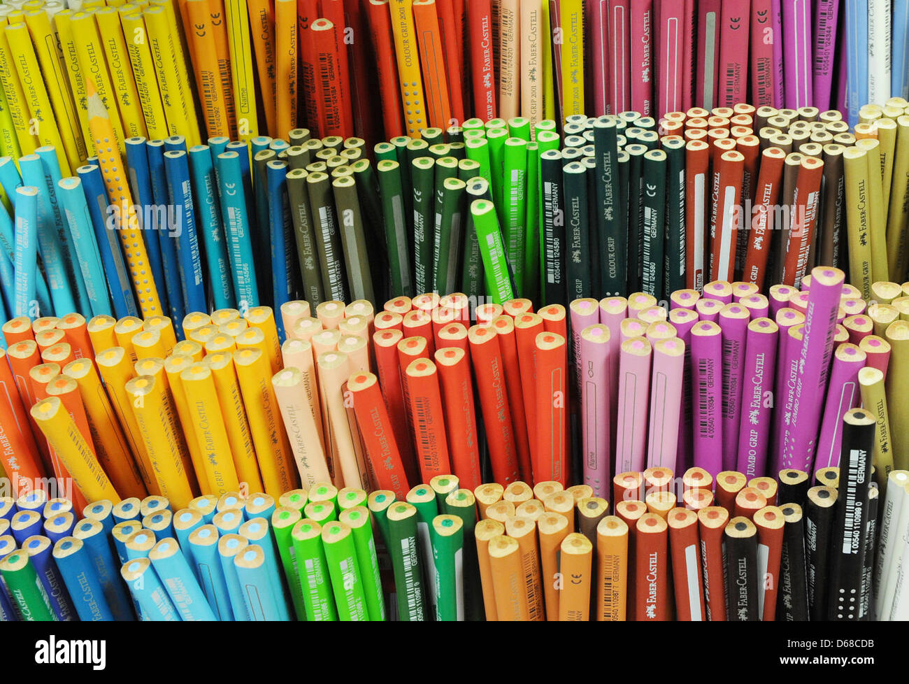 Colorful Faber-Castell School triangular pencils sit on a shelf in a toy store in Berlin, Germany, 19 June 2012. Photo: Jens Kalaene Stock Photo
