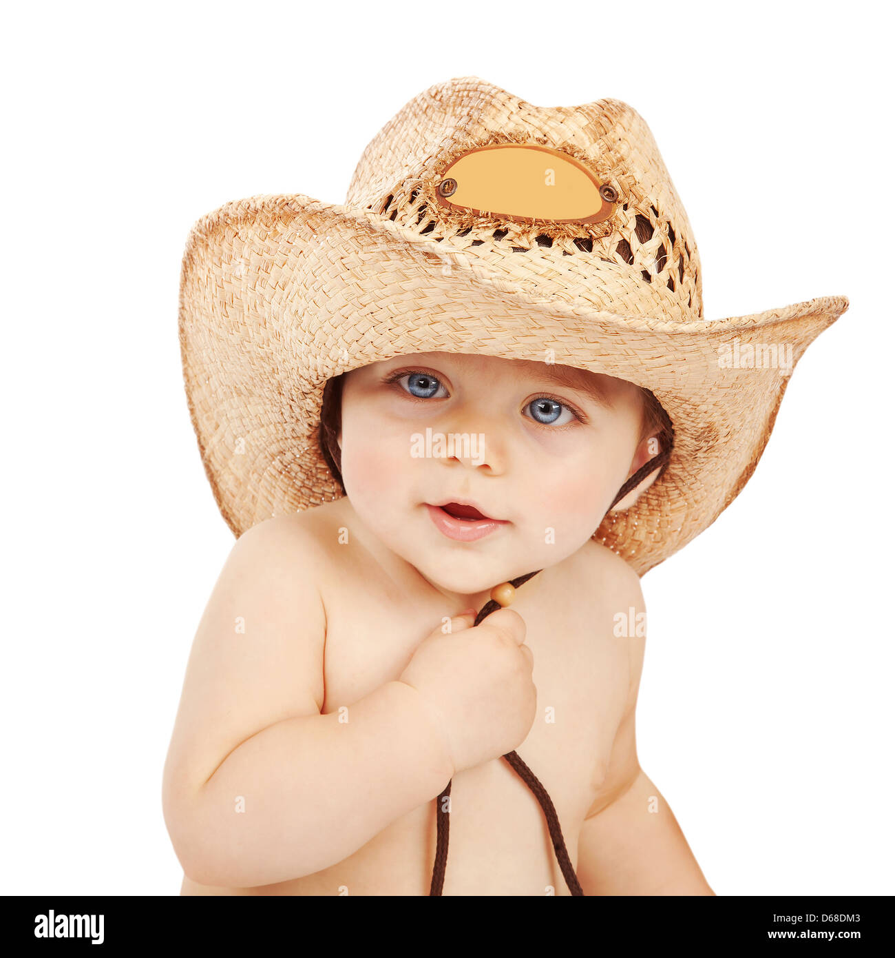 Cute baby boy wearing big cowboy hat isolated on white background, adorable child having fun indoors, happy childhood Stock Photo