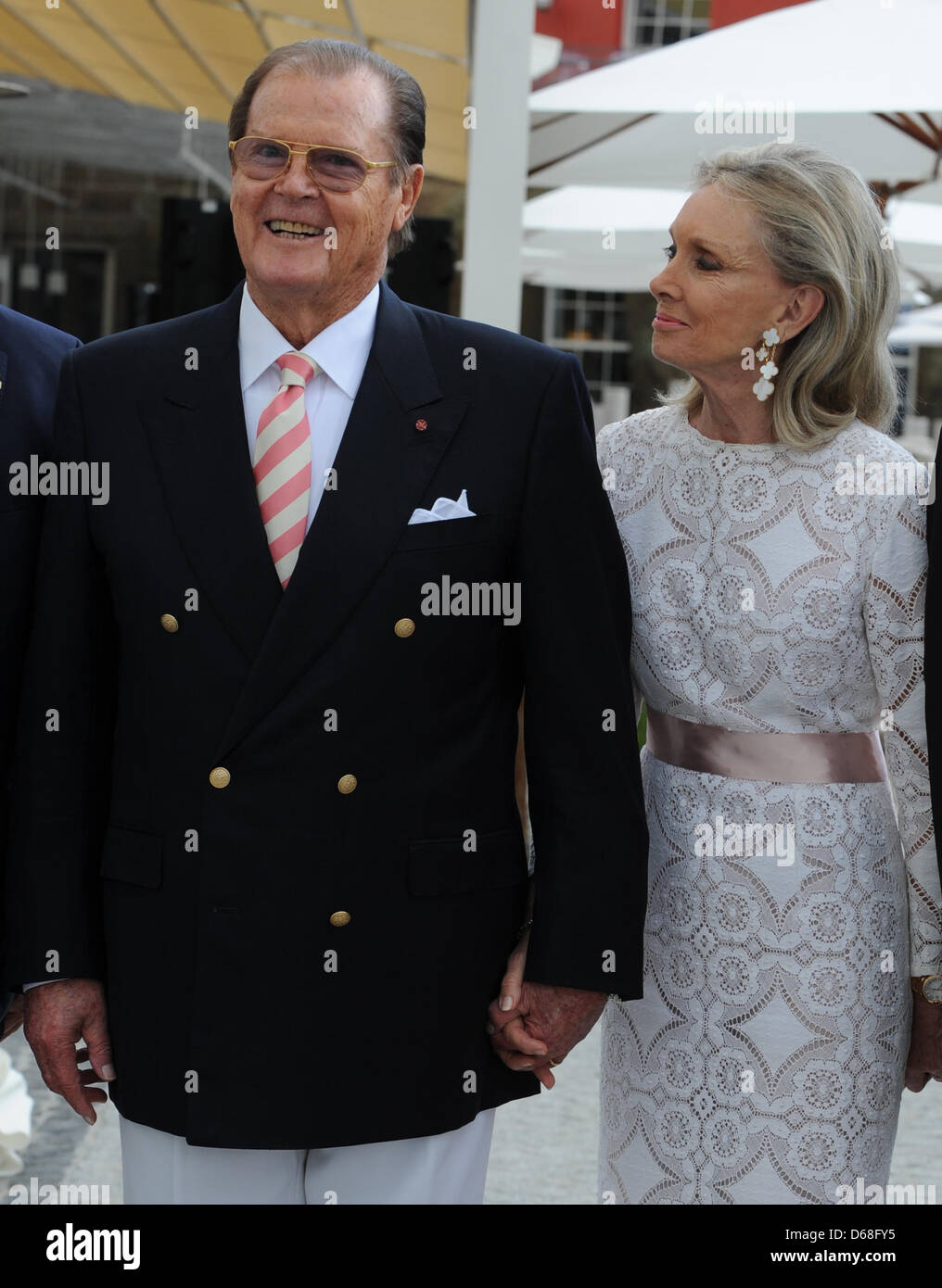 British actor Sir Roger Moore and his wife Kristina Tholstrup pose for the photographers in front of the new hotel 'Bell Rock' at theme park Europa Park in Rust, Germany, 12 July 2012. Photo: Patrick Seeger Stock Photo