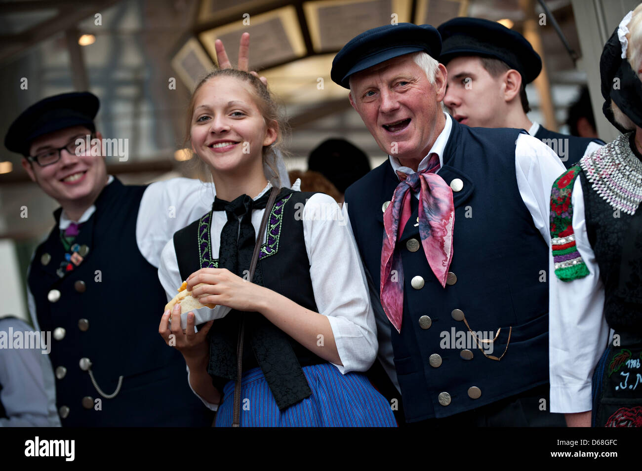 A group of people wearing traditional German costumes enjoy themselves during the Day of Saxonians in Duderstadt, Germany, 14 July 2012. The 32nd Day of Saxonians takes place between 13 and 15 July 2012. Photo: EMILY WABITSCH Stock Photo