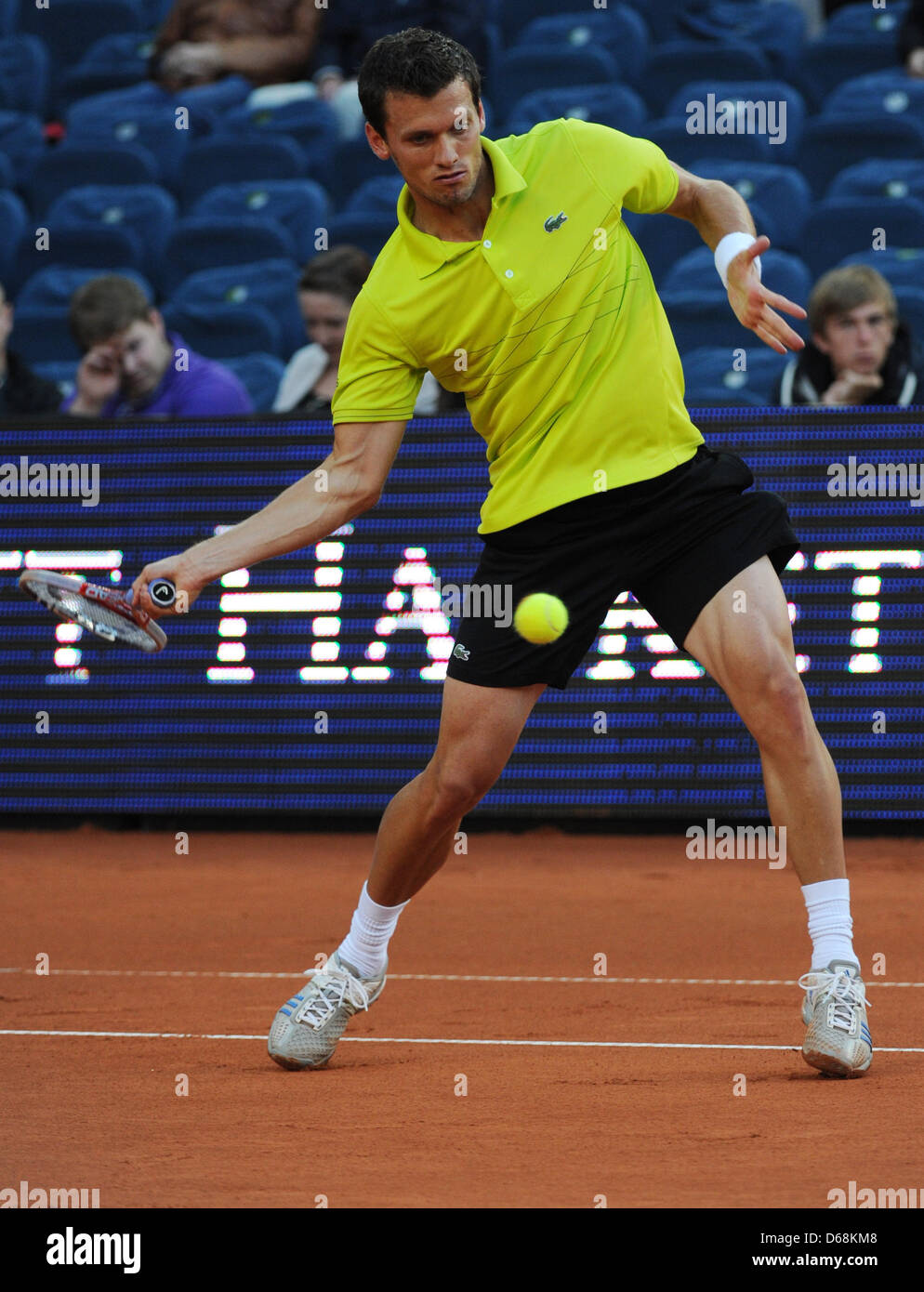 Tobias Kamke from Germany hits the ball during a tennis match against  Almagro from Spain at