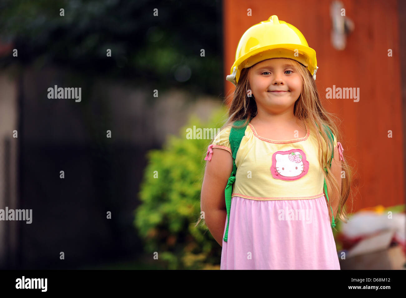 Child wearing a hard hat Stock Photo Alamy