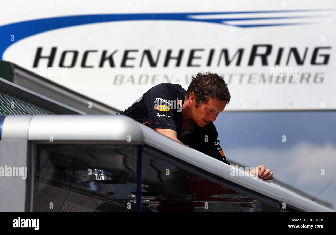 A mechanic of Red Bull Racing team works in the pit line at Hockenheimring race track in Hockenheim, Germany, 18 July 2012. The Formula One Grand Prix of Germany will take place on 22 July 2012. Photo: Jens Buettner dpa/lsw  +++(c) dpa - Bildfunk+++ Stock Photo