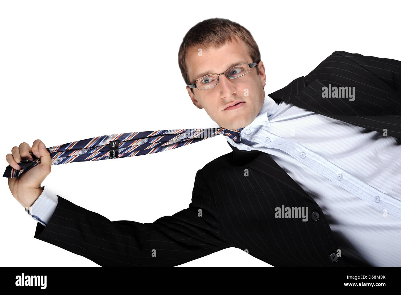 Man Pulling on his neck tie Stock Photo - Alamy