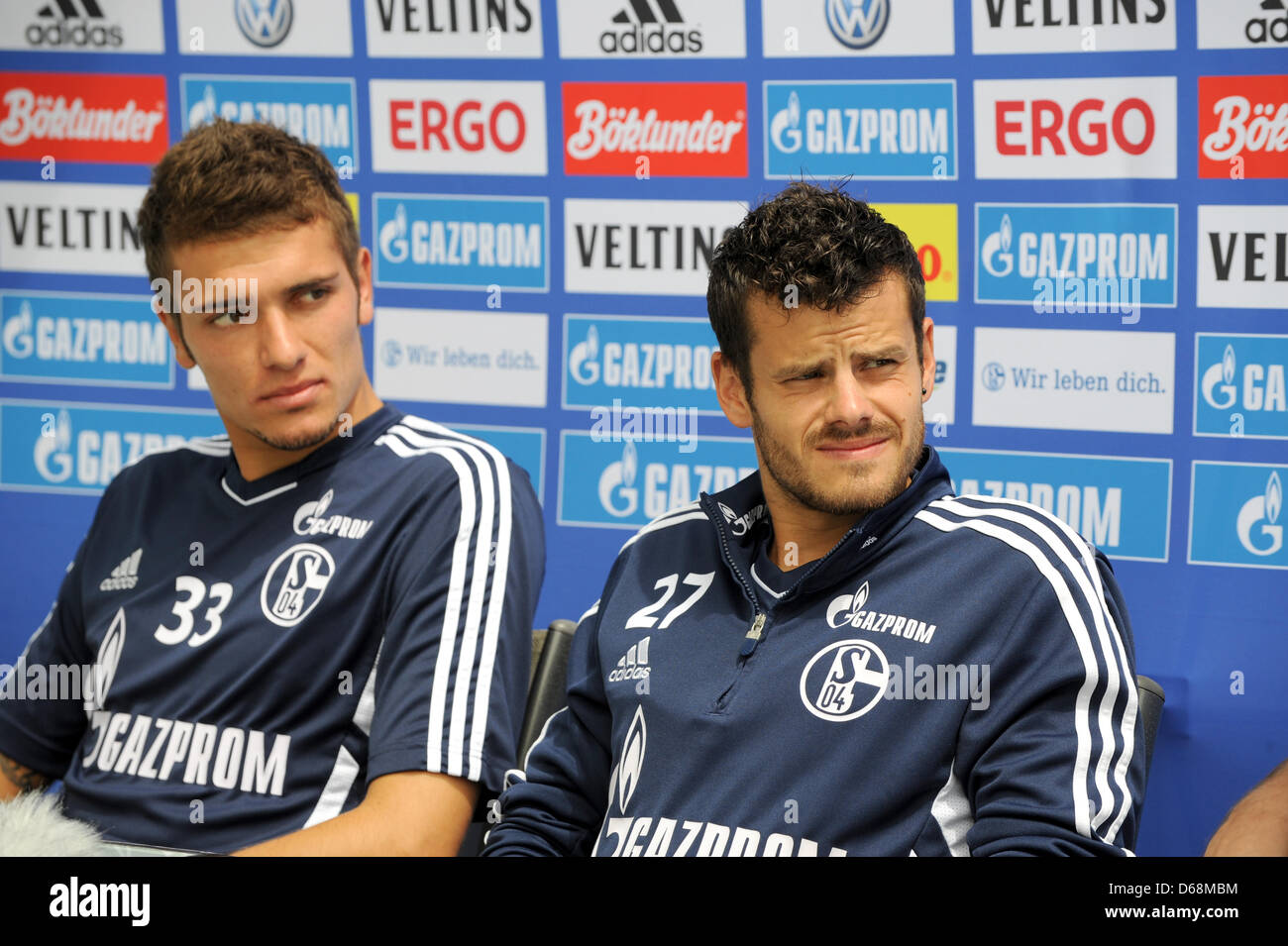Schalke's Roman Neustaedter (L) and Tranquillot Barnetta wait for the start of a press conference at the training camp of FC Schalke 04 in Donaueschingen, Germany, 18 July 2012. Photo: PATRICK SEEGER Stock Photo