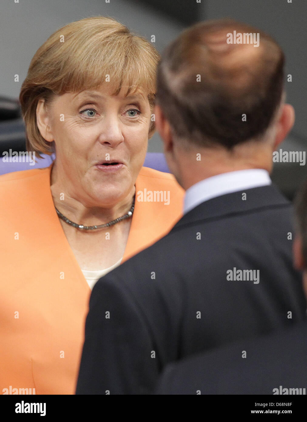 German Chacnellor Angela Merkel (CDU) talks to members of parliament at
