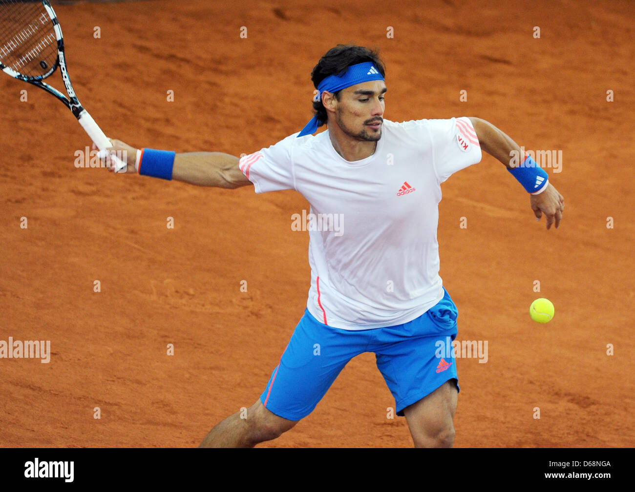 Italian tennis player Fabio Fognini hits the ball during the match against  German player Kohlschreiber at