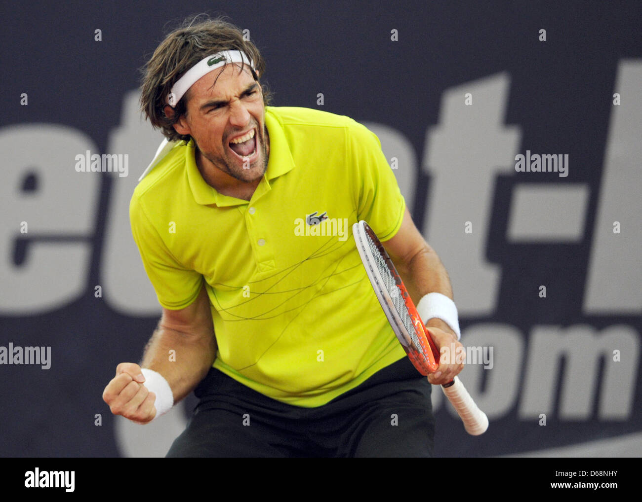 French tennis player Jeremy Chardy celebrates a point during the match  against German player Reister at
