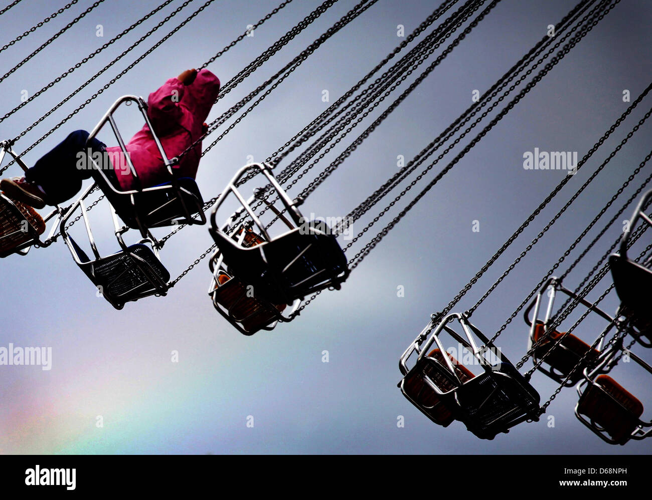 A rainbow is seen behind an amusement ride of the Duesseldorf fair on ...
