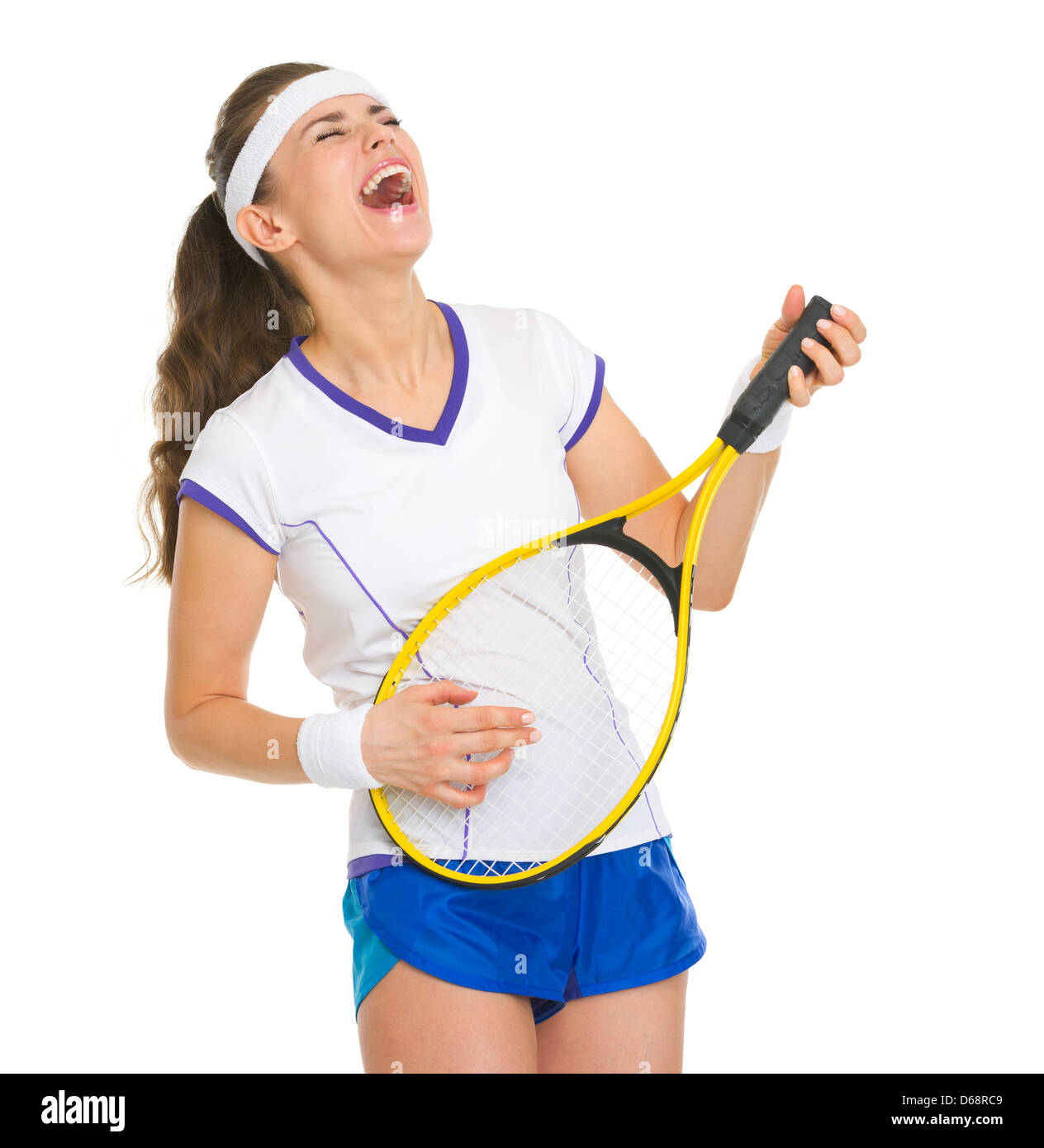 Happy female tennis player playing on racket as on guitar Stock Photo ...