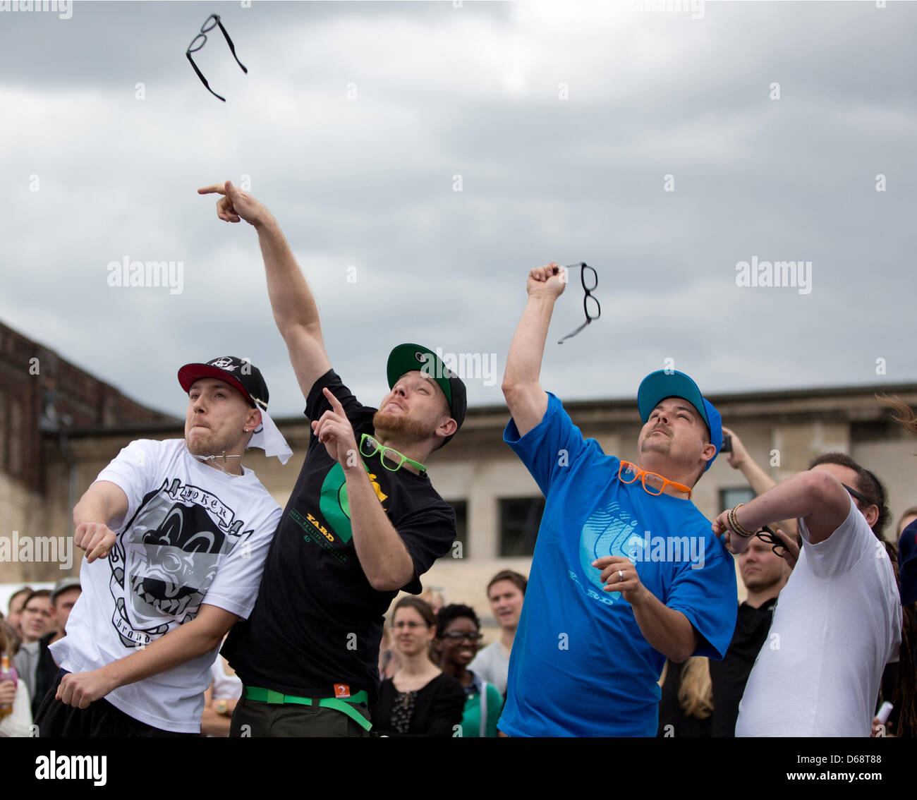 Participants compete in the 'horn-rimmed glasses throwing' event at the Hipster Olympics in Berlin, Germany, 21 July 2012. The Hipster Olympics are not to be taken too seriously  and take place for the secons time. Photo: JOERG CARSTENSEN Stock Photo