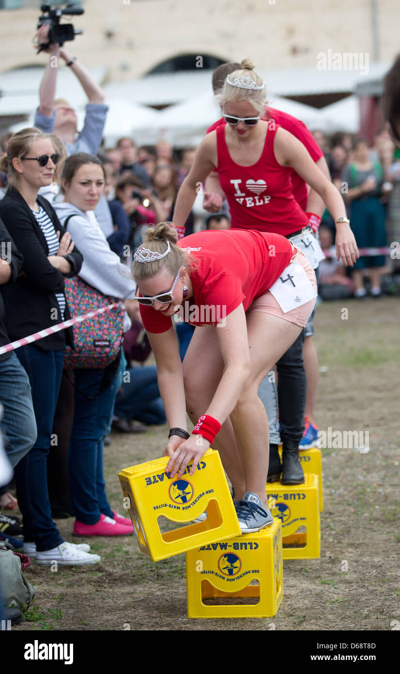 Participants compete in the 'Club Mate crate race' event at the the Hipster  Olympics in Berlin, Germany, 21 July 2012. The Hipster Olympics are not to  be taken too seriously and take