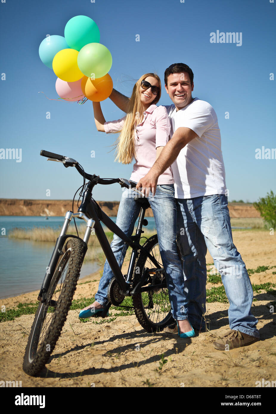 Happy smiling couple with balloons Stock Photo - Alamy