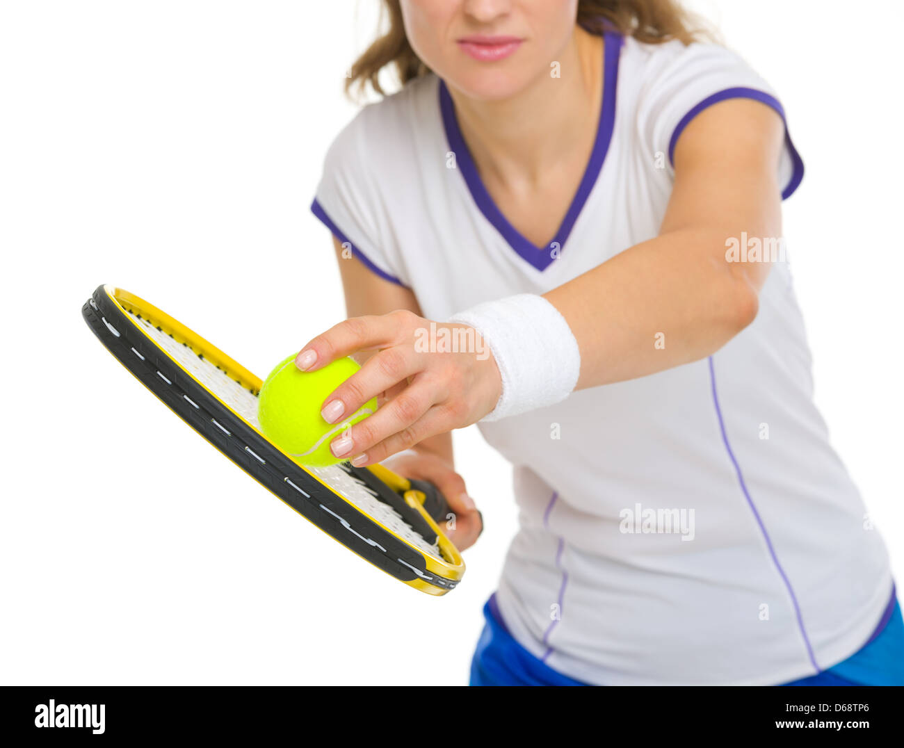 Closeup on female tennis player serving ball Stock Photo