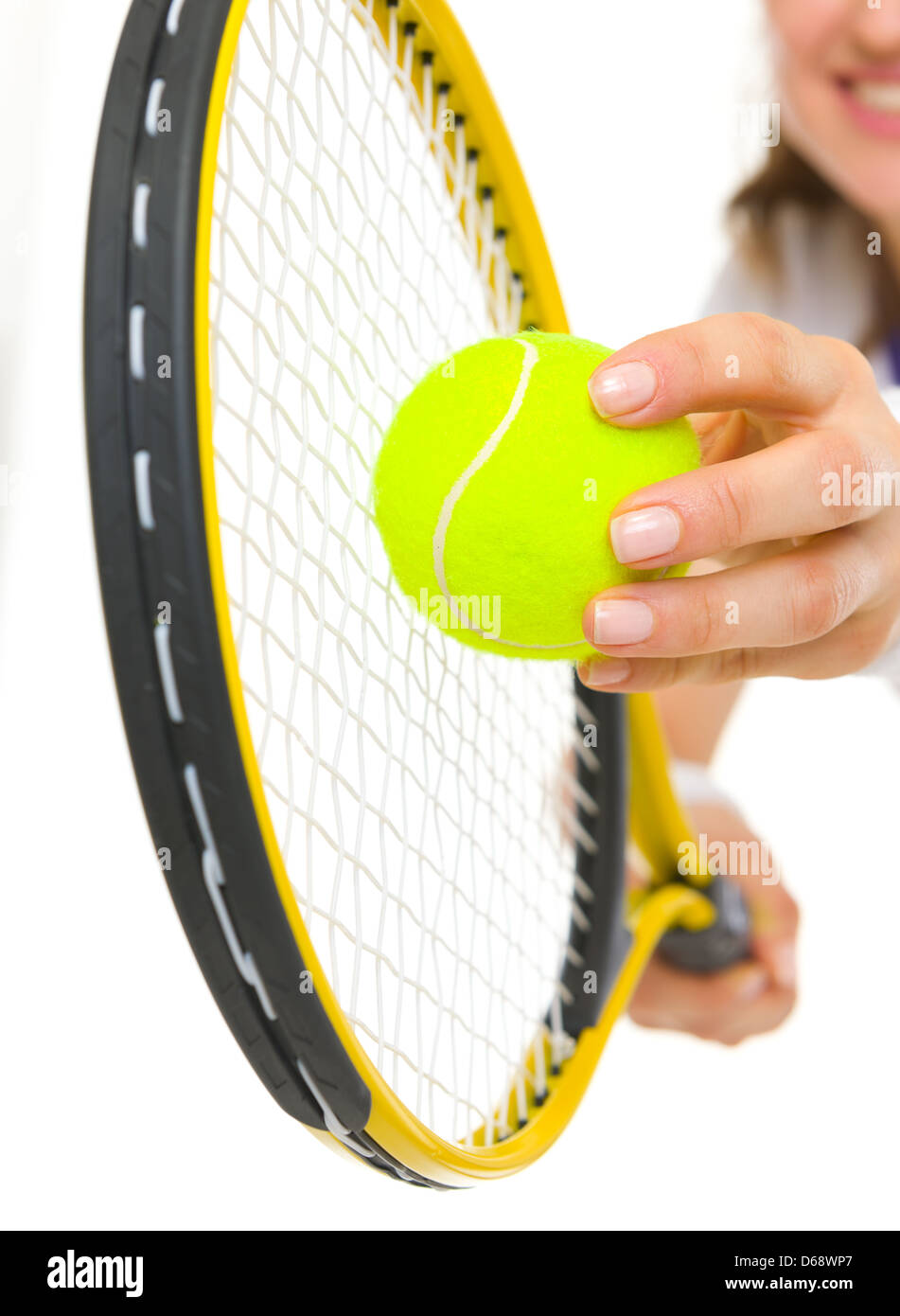 Closeup on female tennis player serving ball Stock Photo