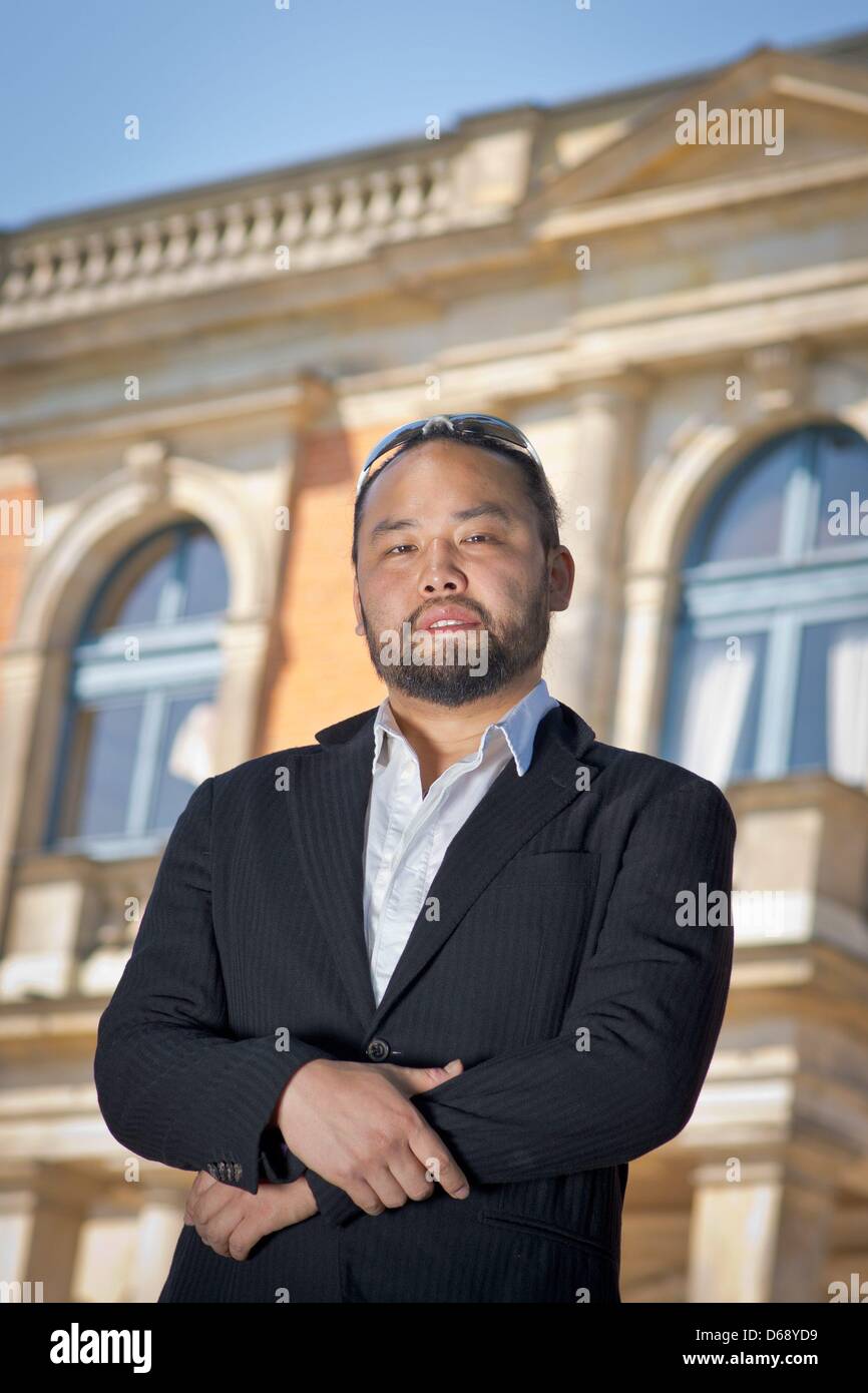 Bassbaritone opera singer Samuel Youn poses in front of the Festspielhaus in Bayreuth, Germany