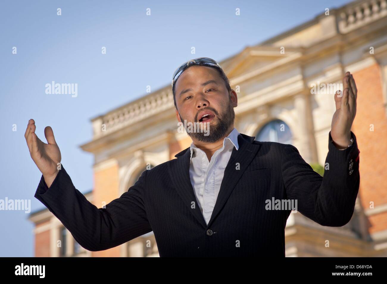 Bassbaritone opera singer Samuel Youn poses in front of the Festspielhaus in Bayreuth, Germany