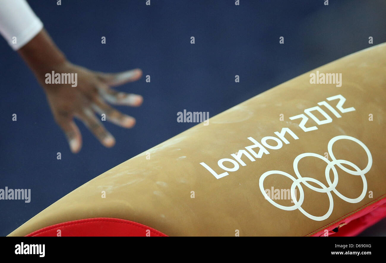 A gymnast performs on the vault during a training session at North