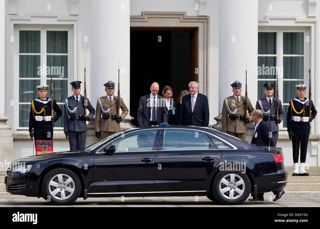 Premier of Bavaria Horst Seehofer (C, CSU) leaves the residence of the Polish President Belweder in Warsaw, Poland, 26 July 2012. Seehofer in his function as acting President of the Bundesrat (Federal Council of Germany) is currently on a two-day visit of Poland. Photo: Daniel Karmann Stock Photo