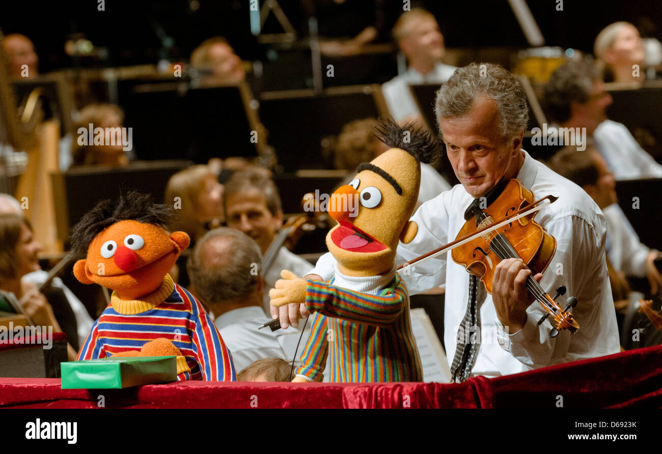 The Sesame Street characters Ernie (L) and Bert take part in a concert at the Schleswig-Holstein Music Festival in Kiel, Germany, 26 July 2012. During the concert of the NDR Radio philharmonic orchestra conducted by Rasmus Baumann, the characters Ernie, Bert and Samson heard and commented Rimsky-Korsakov's 'Flight of the Bumblebee', Mancini's 'Pink Panther' and other pieces. Photo: Stock Photo