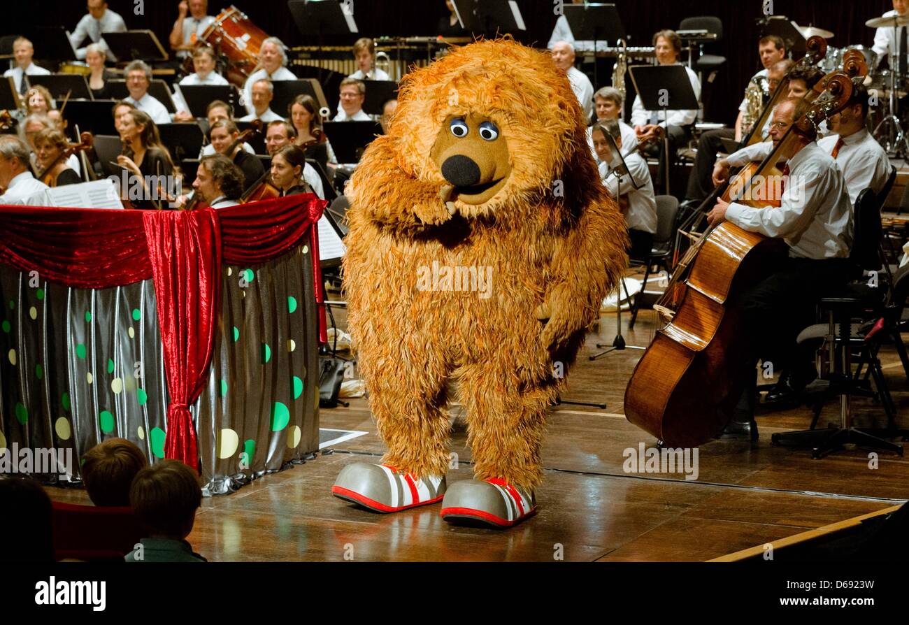 The Sesame Street character Samson takes part in a concert at the Schleswig-Holstein Music Festival in Kiel, Germany, 26 July 2012. During the concert of the NDR Radio philharmonic orchestra conducted by Rasmus Baumann, the characters Ernie, Bert and Samson heard and commented Rimsky-Korsakov's 'Flight of the Bumblebee', Mancini's 'Pink Panther' and other pieces. Photo: Markus Scho Stock Photo