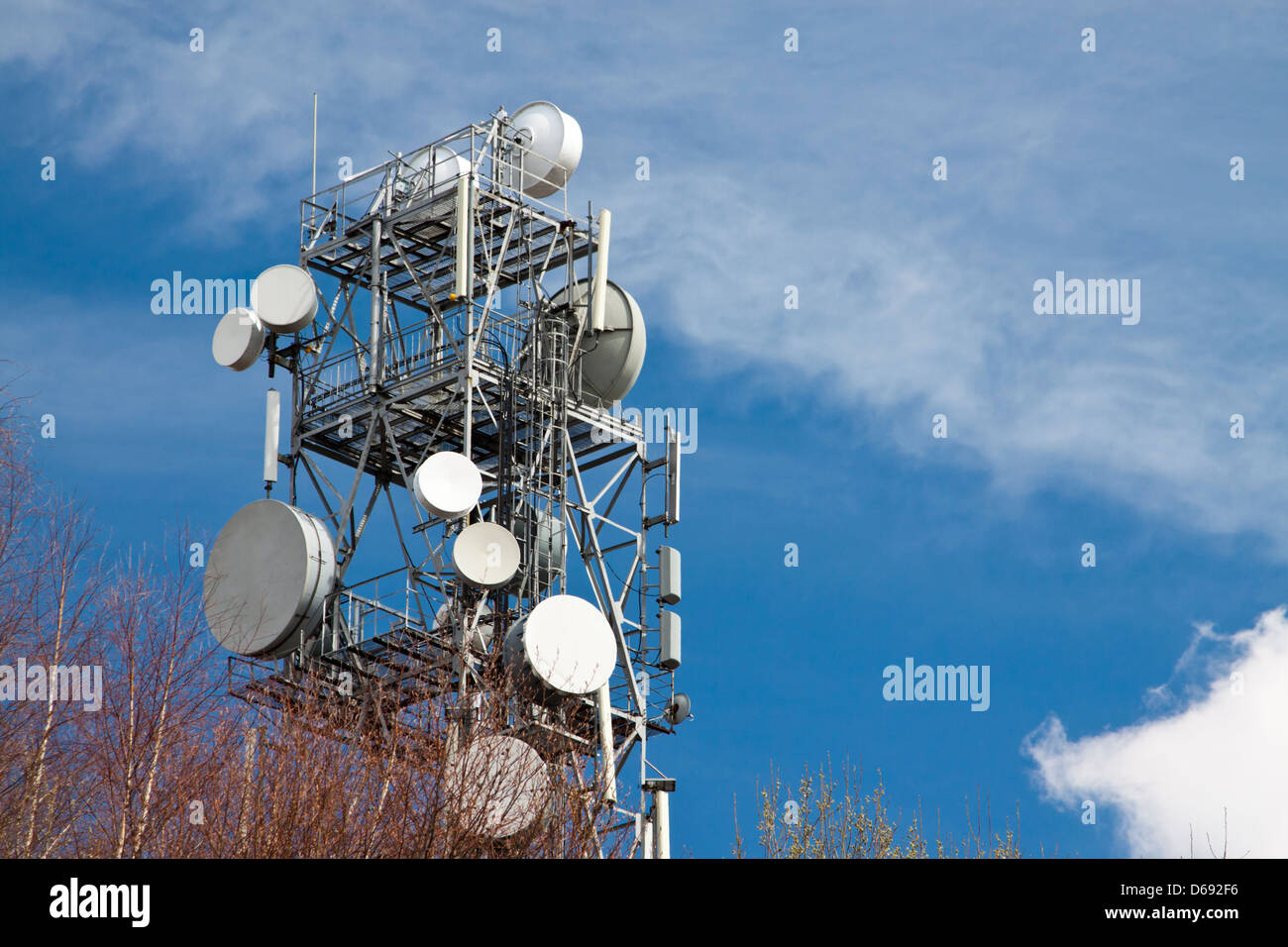 Steel lattice antenna tower against deep blue sky Stock Photo