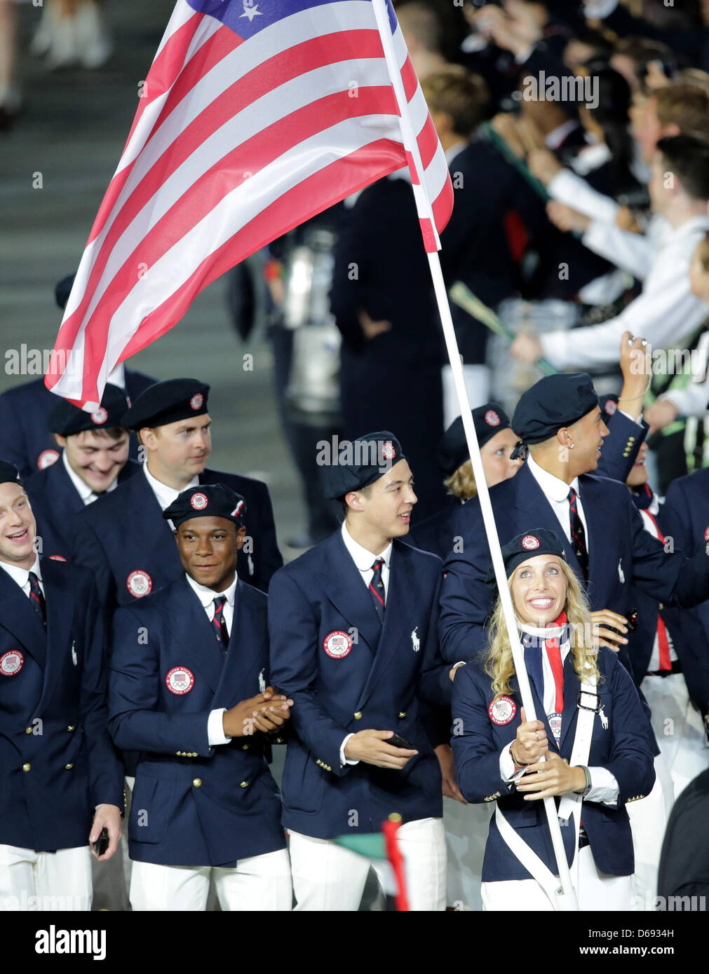 Olympic team of USA with flag bearer and fencer Mariel Zagunis arrive