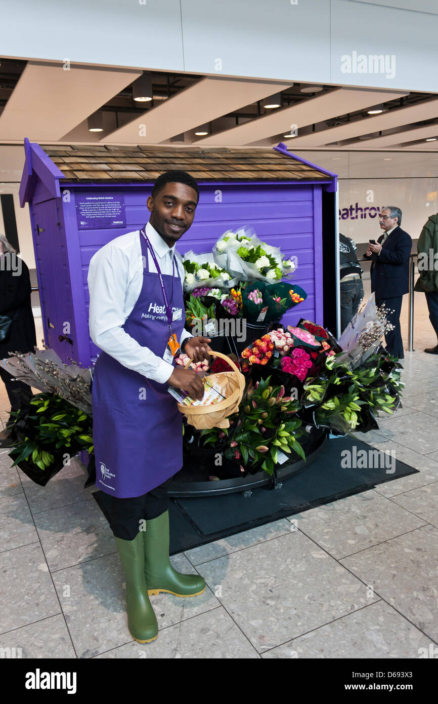 Heathrow volunteer international passengers with a flower