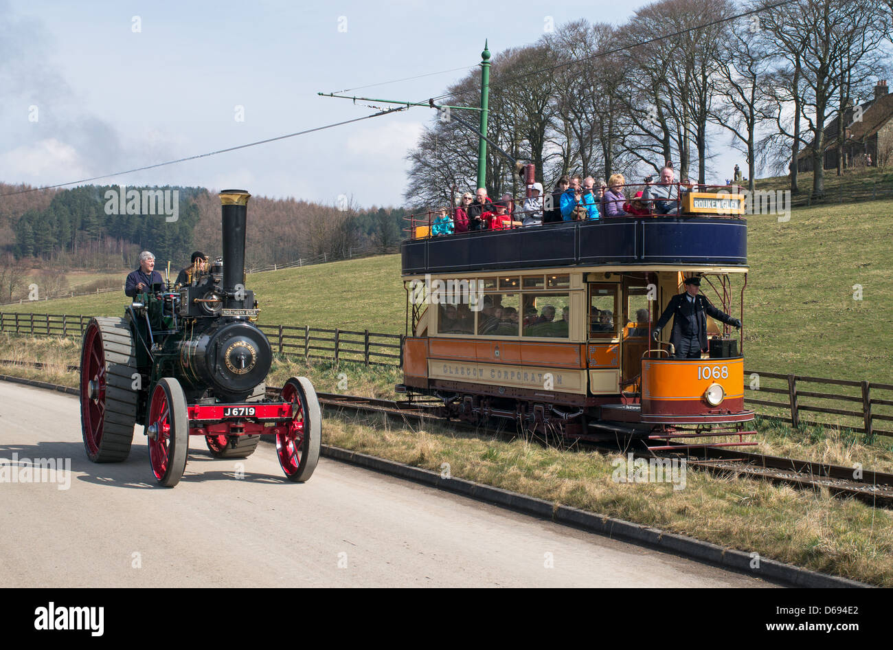 Steam traction engine and open topped tram seen together at Beamish Museum north east England UK Stock Photo