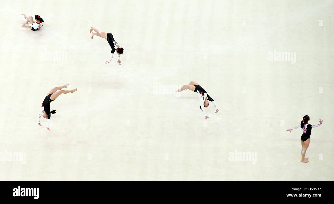 Germany's gymnast Kim Bui performs floor exercises during women's qualification in North Greenwich Arena at the London 2012 Olympic Games, London, Great Britain, 29 July 2012. (multiple exposure). The 2012 Summer Olympic Games will be held in London from 27 July to 12 August 2012. Photo: Friso Gentsch dpa  +++(c) dpa - Bildfunk+++ Stock Photo