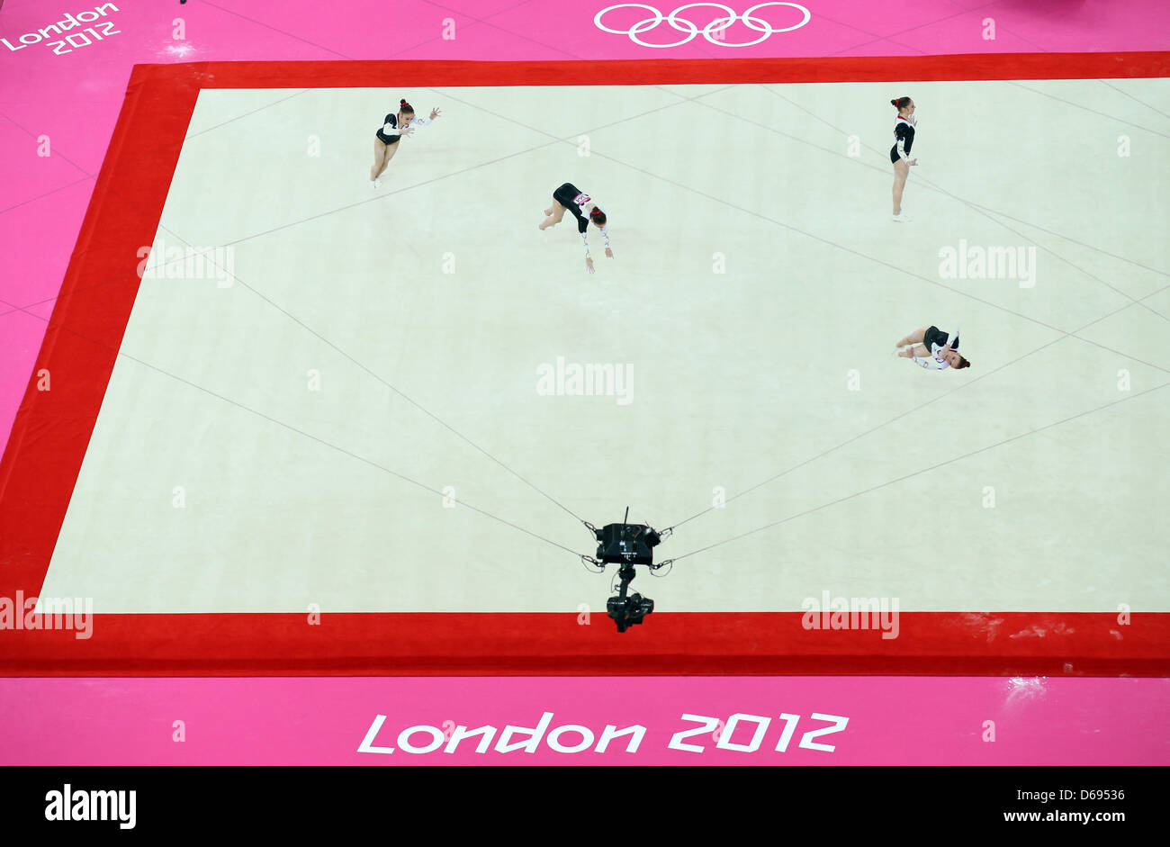 Germany's gymnast Nadine Jarosch performs floor exercises during women's qualification in North Greenwich Arena at the London 2012 Olympic Games, London, Great Britain, 29 July 2012. (multiple exposure). The spider-cam is filming her. The 2012 Summer Olympic Games will be held in London from 27 July to 12 August 2012. Photo: Friso Gentsch dpa  +++(c) dpa - Bildfunk+++ Stock Photo