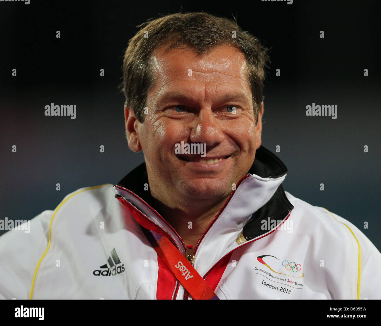 Michael Behrmann, head coach of the German field hockey Women team, smiles after winning against the United States during women's field hockey at Olympic Park Riverbank Arena for the London 2012 Olympic Games Field Hockey competition in London, Britain, 29 July 2012. Photo: Christian Charisius  +++(c) dpa - Bildfunk+++ Stock Photo