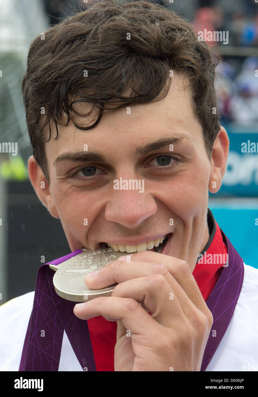 Germany's Sideris Tasiadis shows his silvermedal after the final race in the Canoe Slalom Men's Single competition at Lee Valley White Water Centre, during the London 2012 Olympic Games, London, Great Britain, 31 July 2012. Photo: Peter Kneffel dpa  +++(c) dpa - Bildfunk+++ Stock Photo